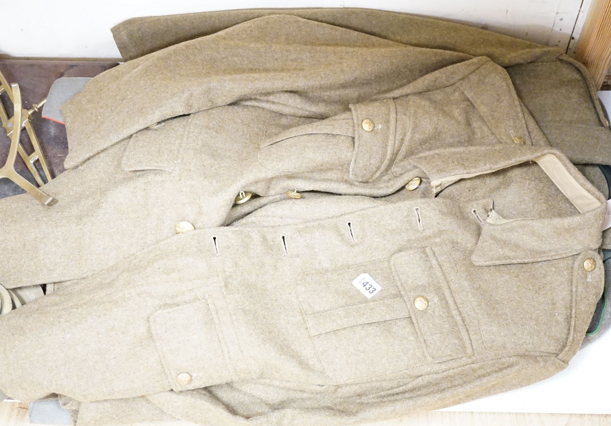 Two German WWI jackets and a similar British jacket.